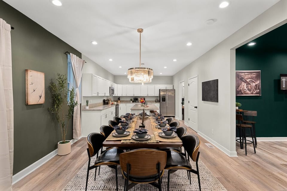 Large Eat-In Dining: Boasting a grand table and high-end decor, this open-concept space is perfect for hosting memorable holiday feasts or celebratory gatherings.