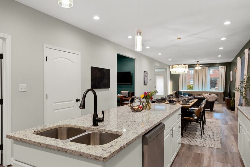 Gourmet Culinary Space: Features a professional-grade range, dual-basin sink, and an expansive open-concept layout that keeps the chef connected to all the action.