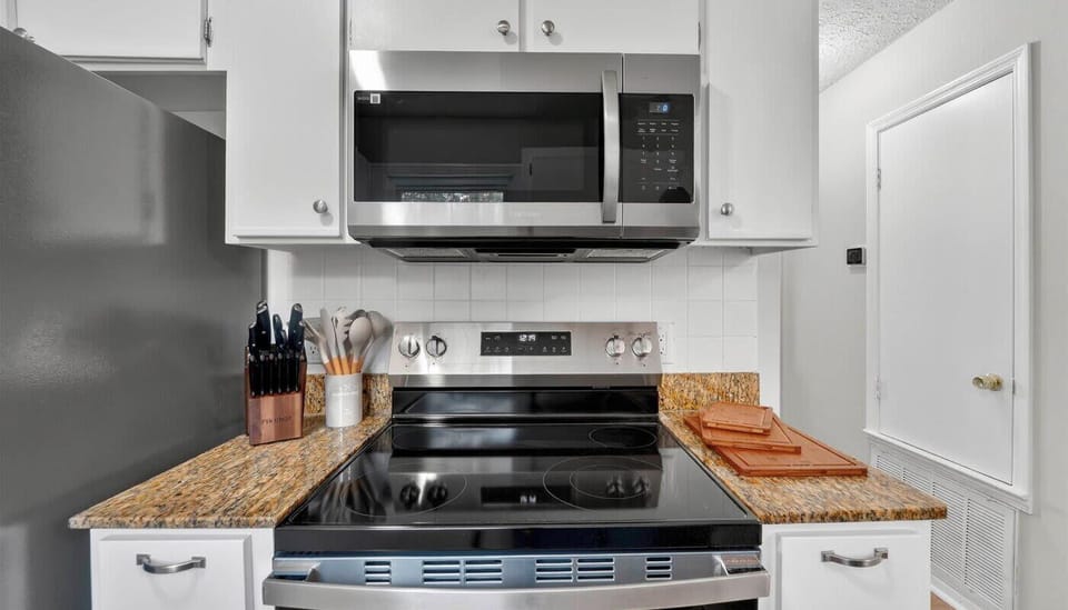 Warning: Kitchen may inspire spontaneous cooking competitions. Fully stocked, stylish, and begging for your inner chef (or just your love of takeout).