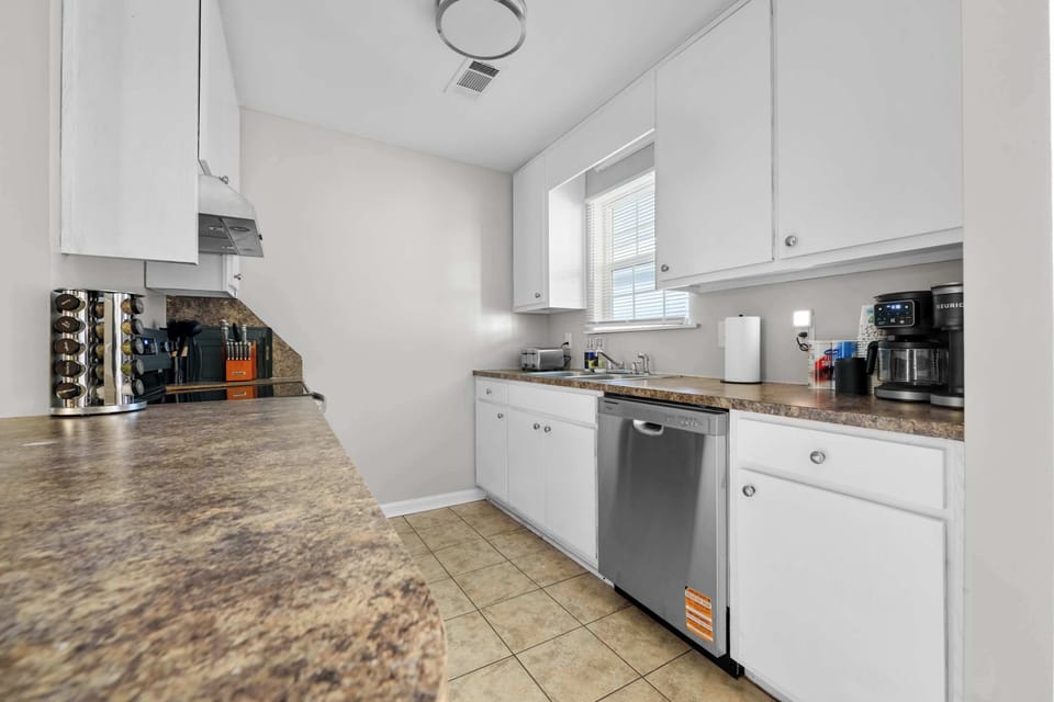 Sleek cabinetry and full stovetop—ideal for contractors who prefer home-cooked meals.