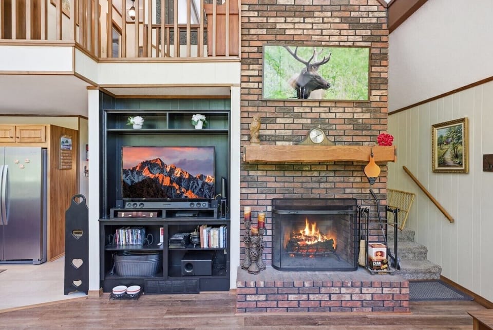 Living Room | Brick Fireplace | Media Console & Loft Railing