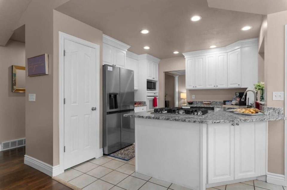 Kitchen 1 | Stainless Refrigerator | Pantry Door & Counterspace