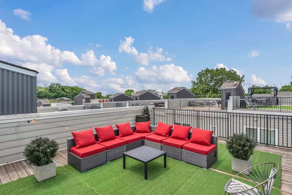 Rooftop patio with grill, corn hole, and views perfect for lounging. | Unit B