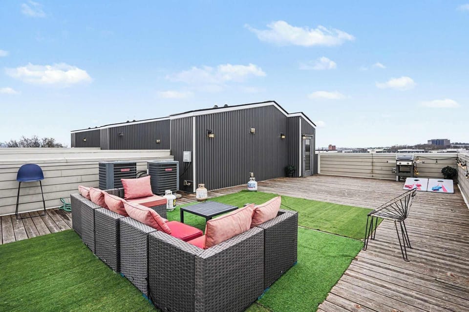 Rooftop patio with grill, corn hole, and views perfect for lounging | Unit A