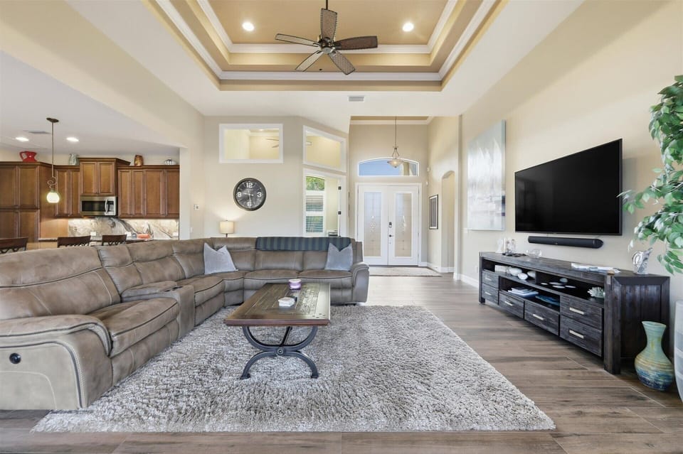 Living room with comfy seating and 70-inch Smart TV