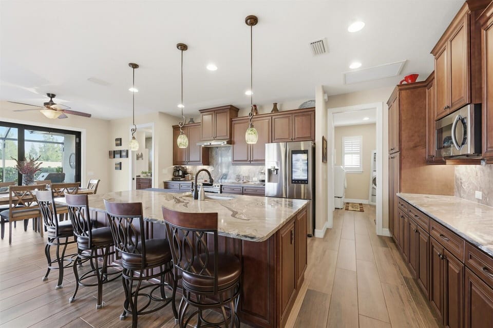 Beautiful, fully-equipped kitchen overlooking the living room and dining area