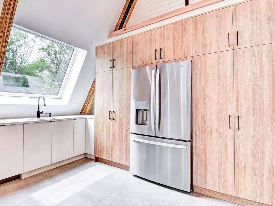 Well socked kitchen with modern appliances spices, baking essentials. 