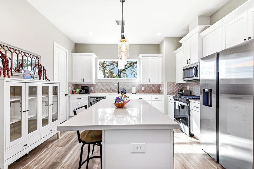 Modern kitchen with plenty of counter space and seating.