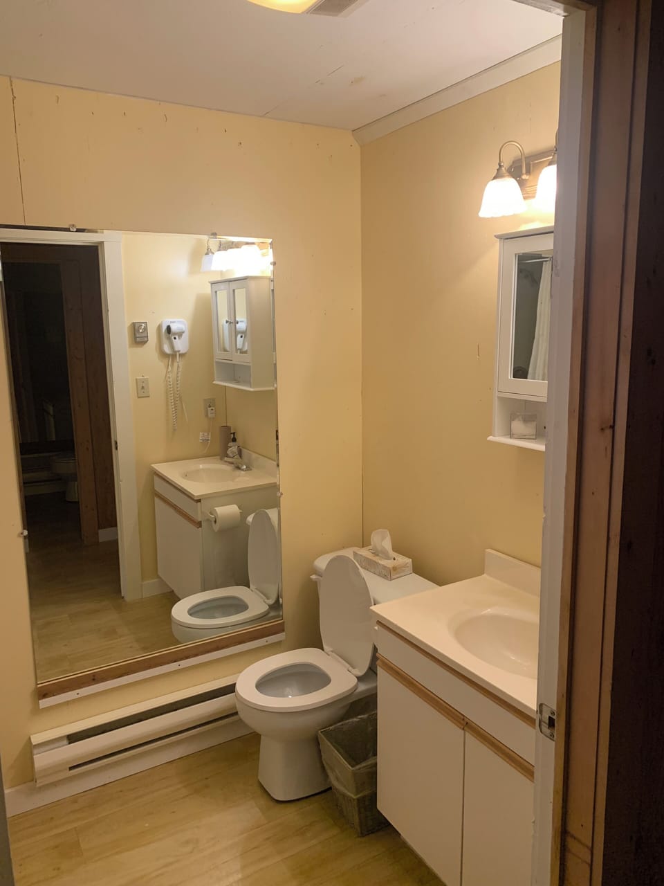 One of two full bathrooms on the ground level. Each full bathroom has a shower, toilet, and vanity. There is also a half bathroom upstairs located between the two upper level bedrooms
