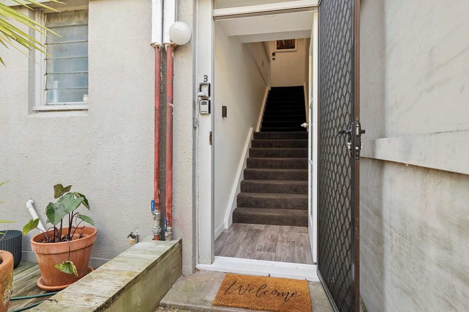 The front door from the ground level - head up the stairs to the apartment.