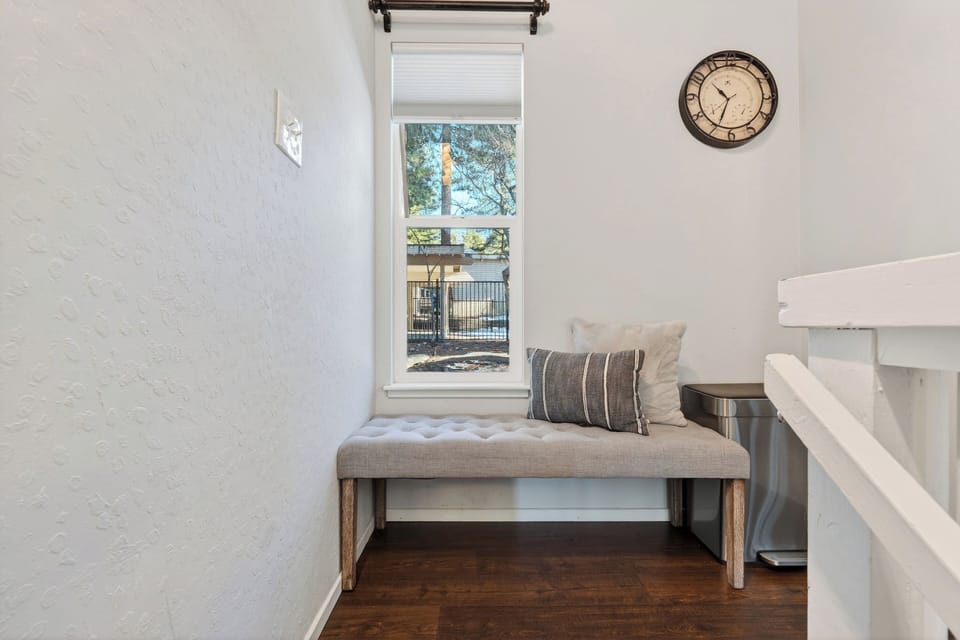 Small window-side bench seat located near the kitchen area.
