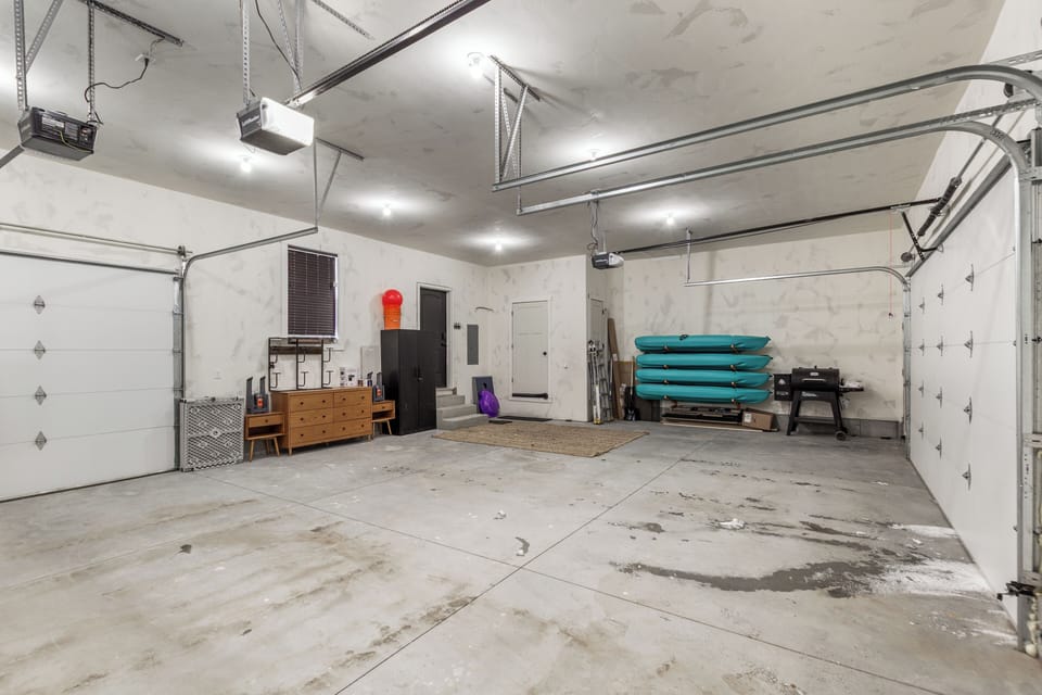 This oversized 3-car garage features drive-through access for effortless parking and unloading. Guests can also enjoy complimentary kayaks, perfect for exploring Island Park's lakes and rivers with ease.