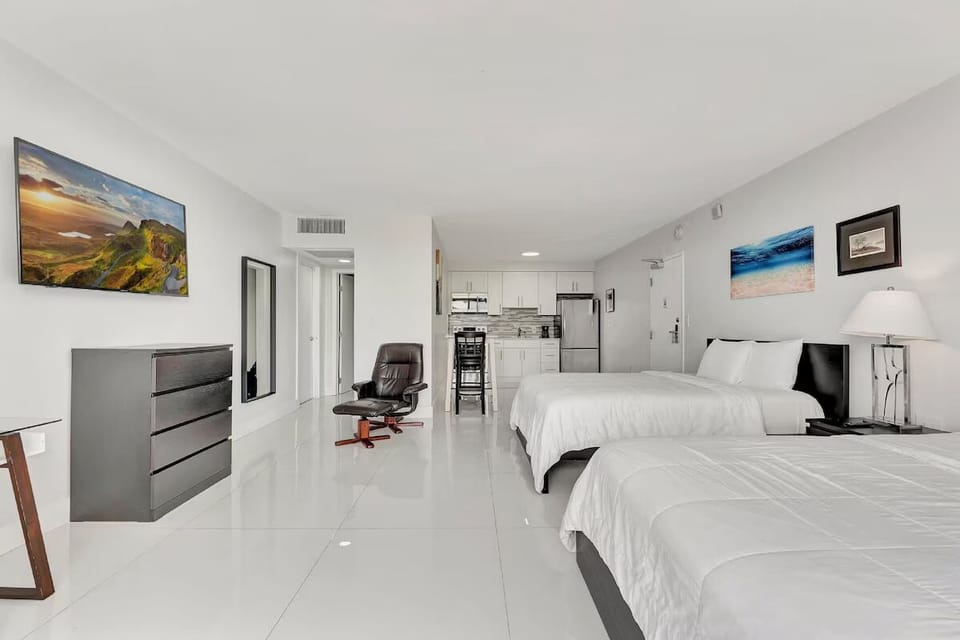 Spread out in an airy studio with convenient kitchenette access.