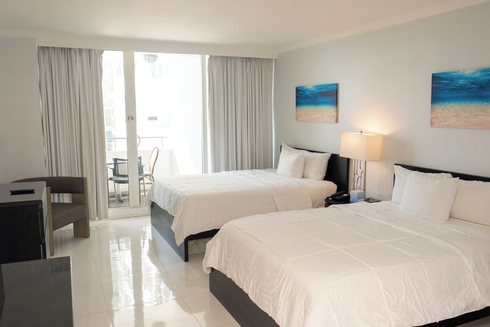 Lounge comfortably with two beds and breezy balcony light
