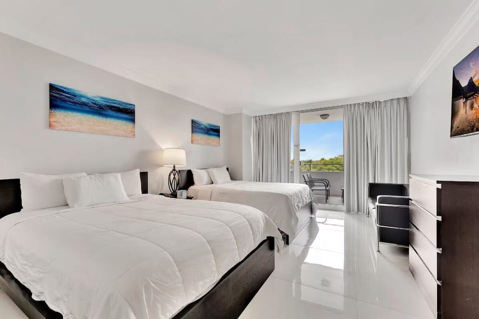 Unwind in crisp double beds with balcony sunshine nearby