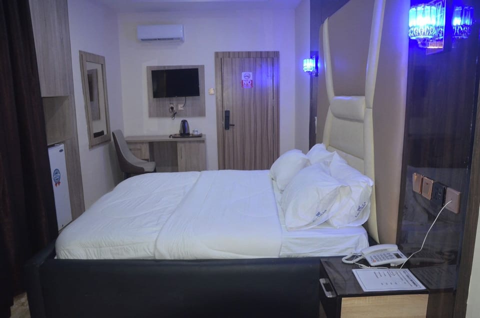 Deluxe Room, Balcony, City View | In-room safe, desk, laptop workspace, blackout drapes