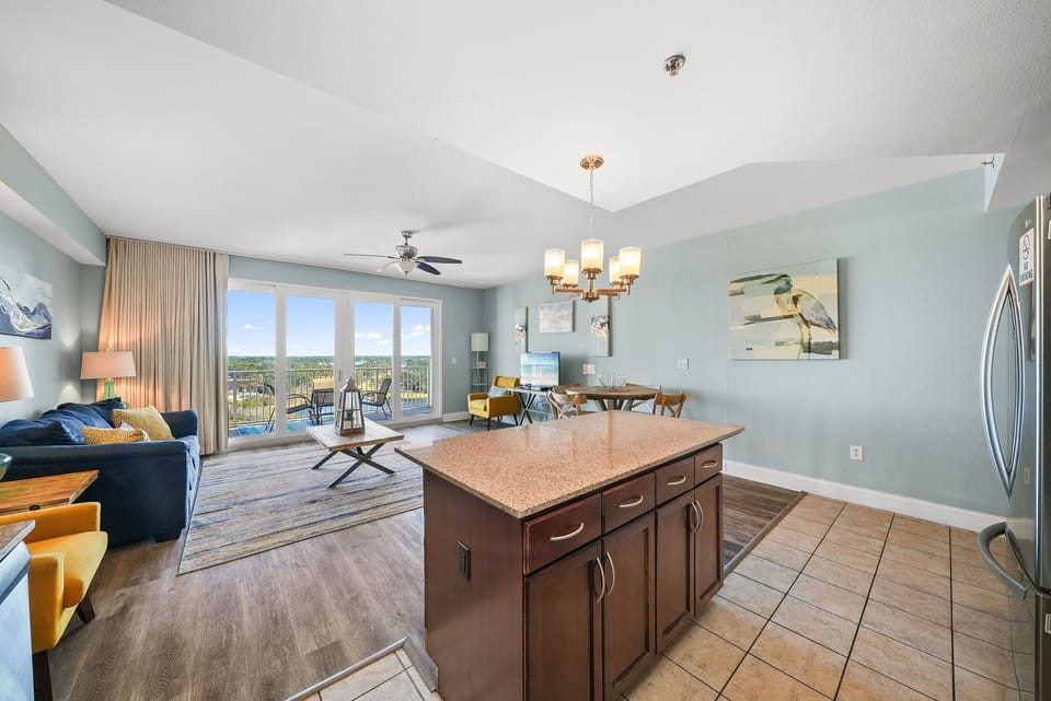 Open-concept living area with a large window offering scenic views.