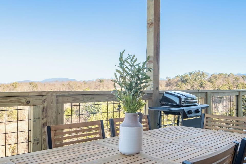 Savor meals on your private deck with stunning mountain views and fresh air, complete with BBQ for perfect outdoor dining.