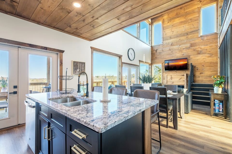 Your gourmet kitchen features granite countertops and sleek appliances, perfect for creating memorable meals while enjoying stunning natural light.