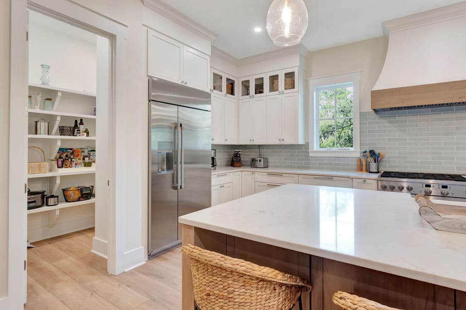 The walk in pantry provides plenty of space for your every need.