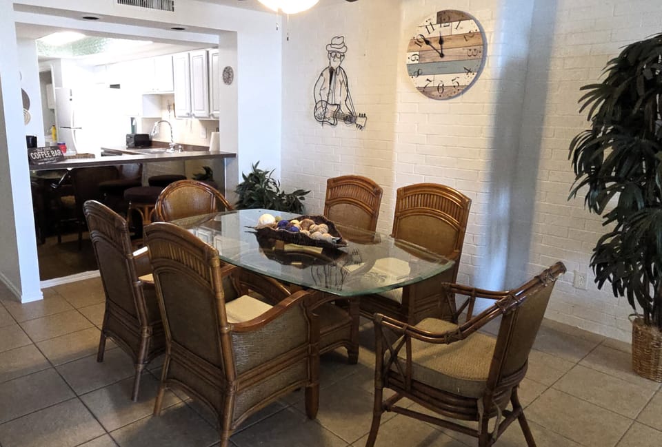 The dining area is perfect for a meal, game night, or a puzzle
