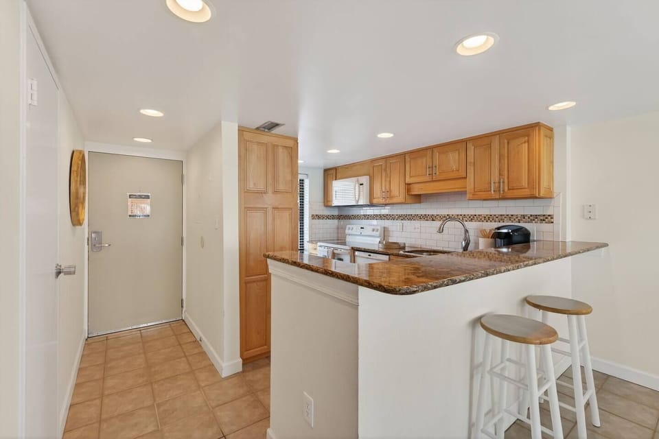 A welcoming kitchen with ample counter space—perfect for casual breakfasts, happy hour bites, or late-night snacks.