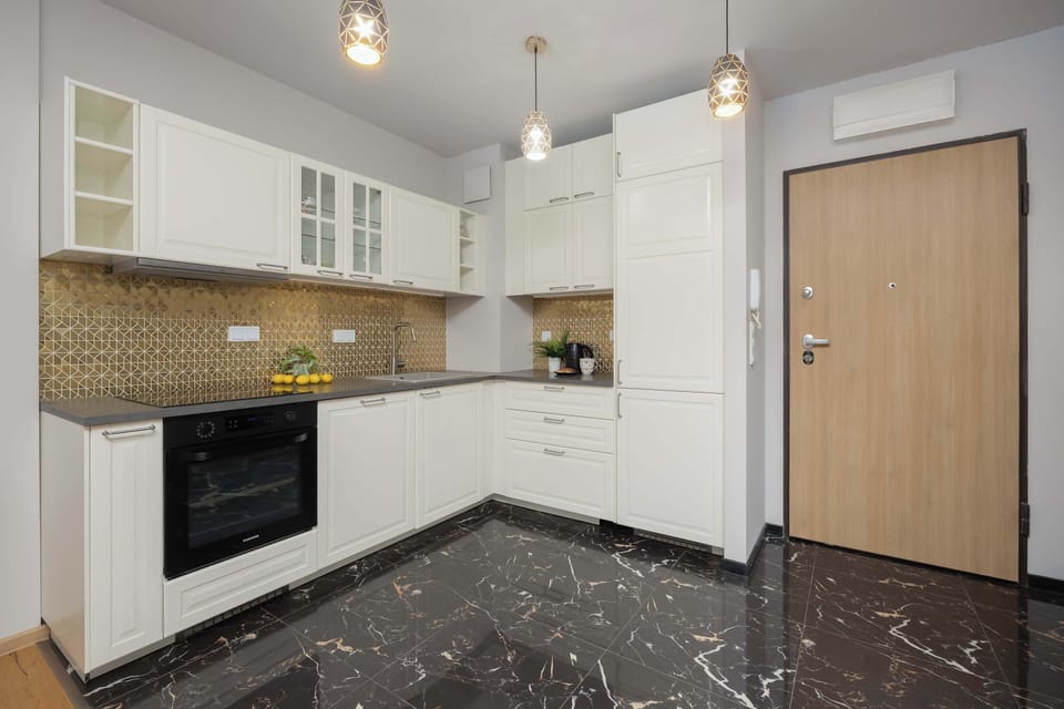 Functional kitchen with storage space and clean finishes.