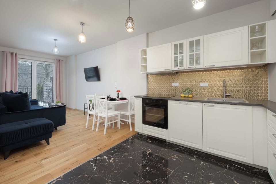 Perspective from the living room towards the bright kitchen area.