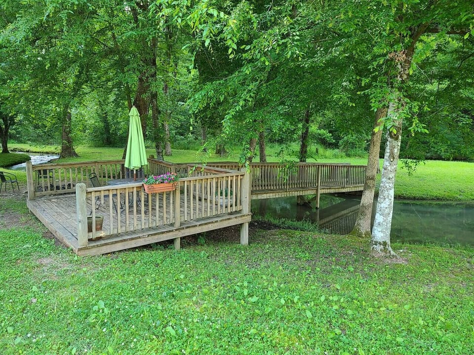 Mini deck across from the cabin with bridge leading to peninsula