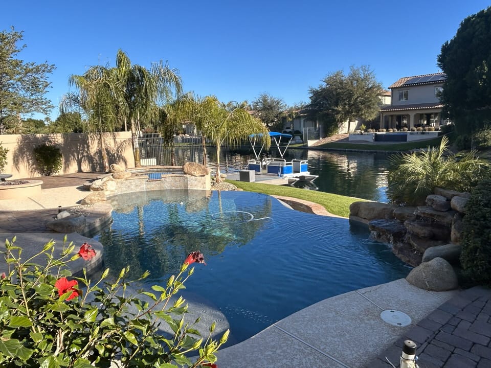 Infinity play pool with  spa and waterfall.
