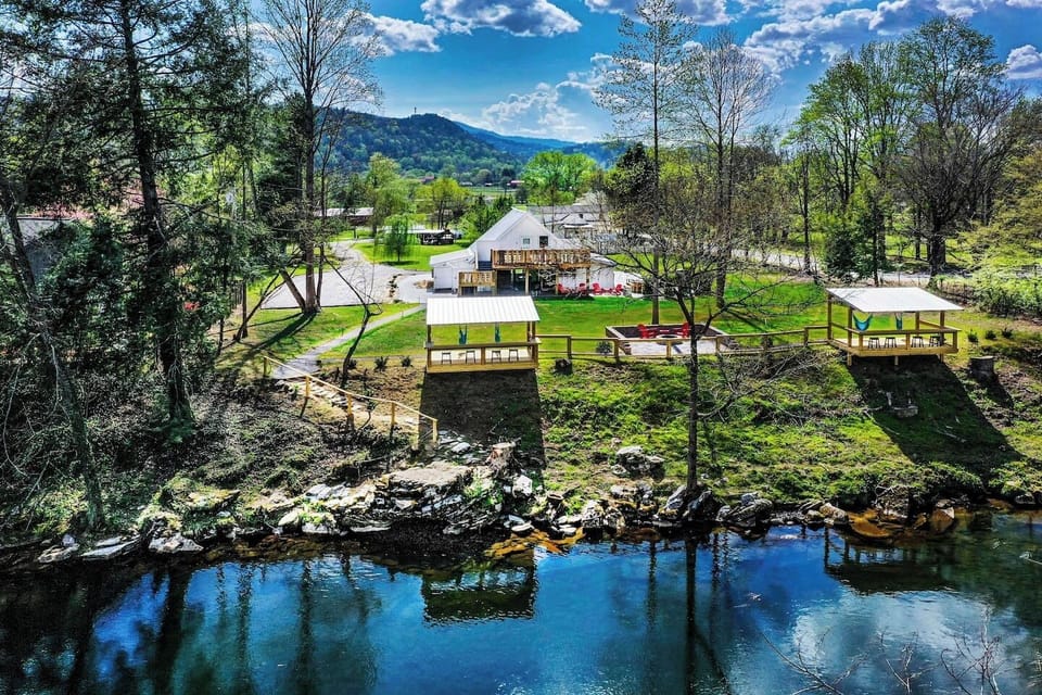 View from the River of Barndo 925, Decks, and Fire Pit overlooking the River. 