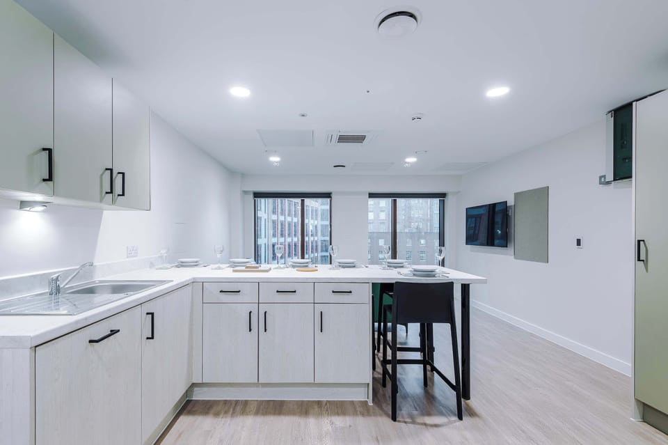 Shared kitchen with multiple worktops and seating