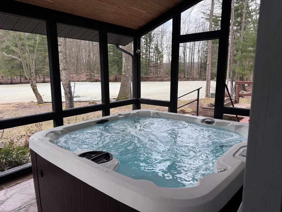 Hot tub overlooking the pond.  Hot tub available for use year-round.  