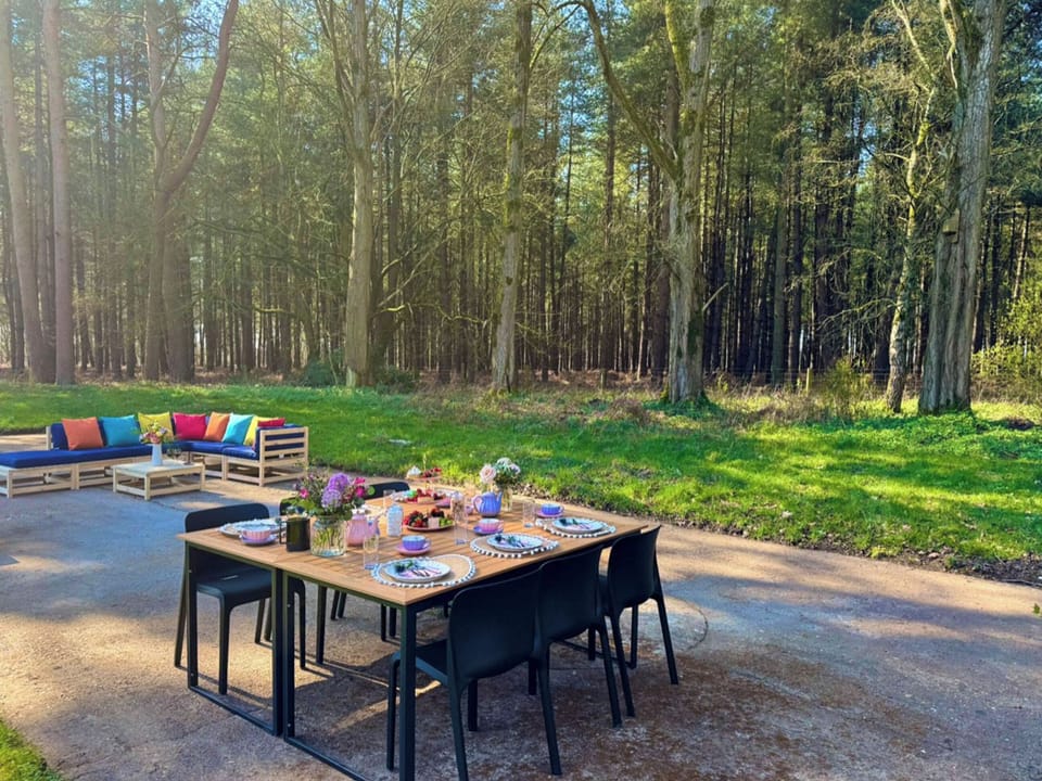 Outdoor seating area with forest view | Falconer&rsquo;s Lodge, High Ash