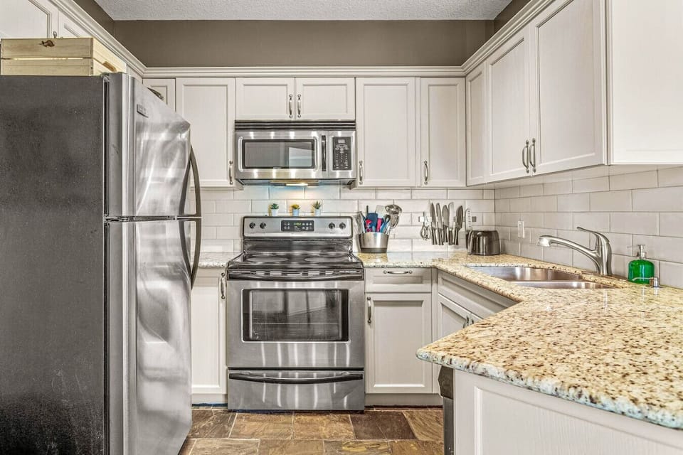The fully equipped kitchen boasts essential appliances and ample counter space, making it the perfect setting for preparing delicious meals.