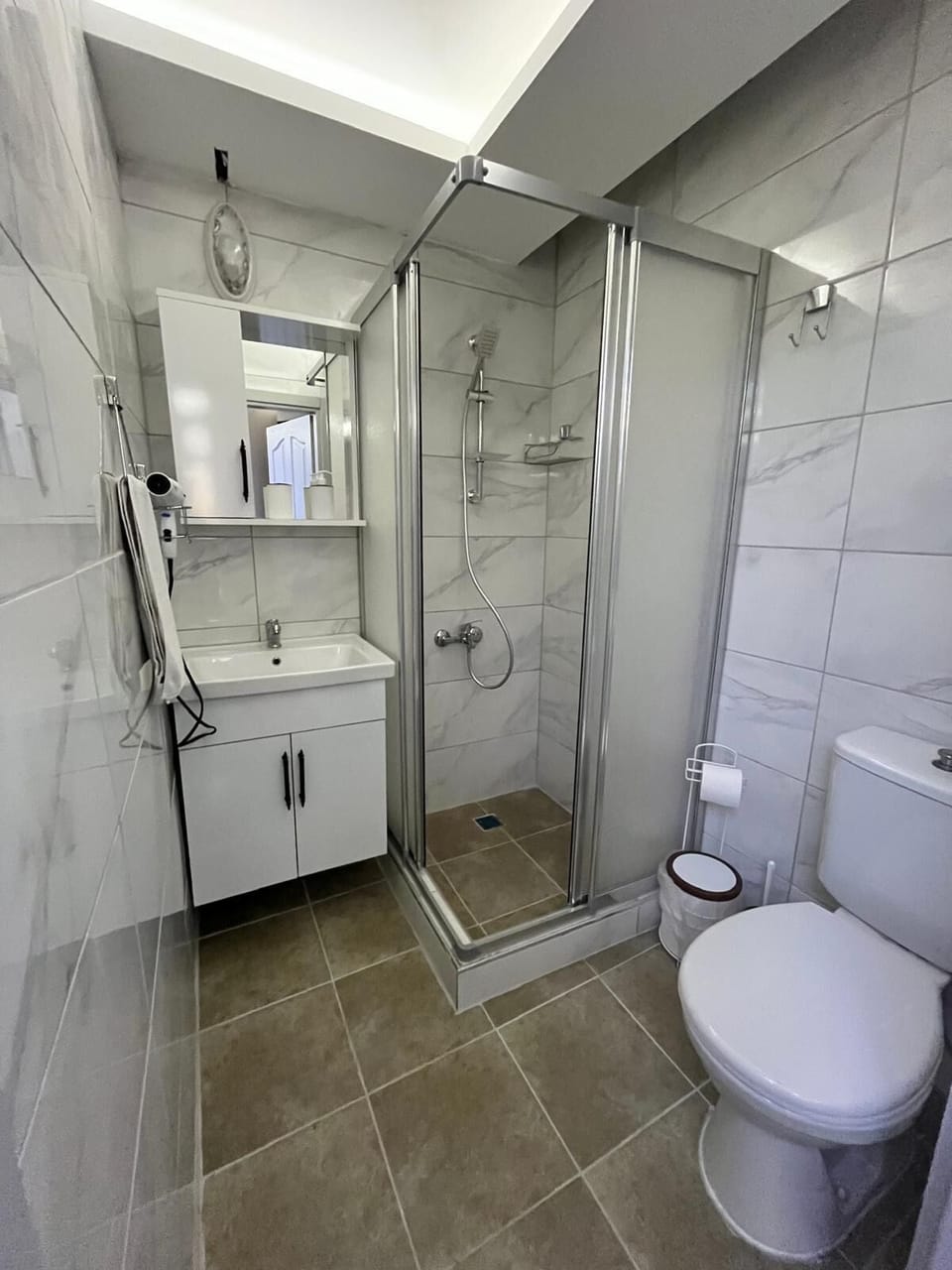 Separate tub and shower, hair dryer, towels, soap