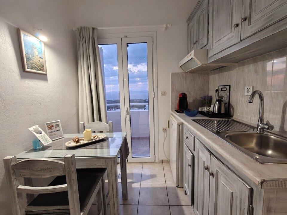 Comfort Suite, Sea View | Private kitchen | Mini-fridge, espresso maker, coffee/tea maker, cookware/dishes/utensils