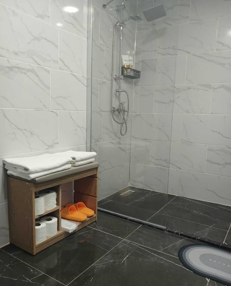 Shower, free toiletries, towels, soap