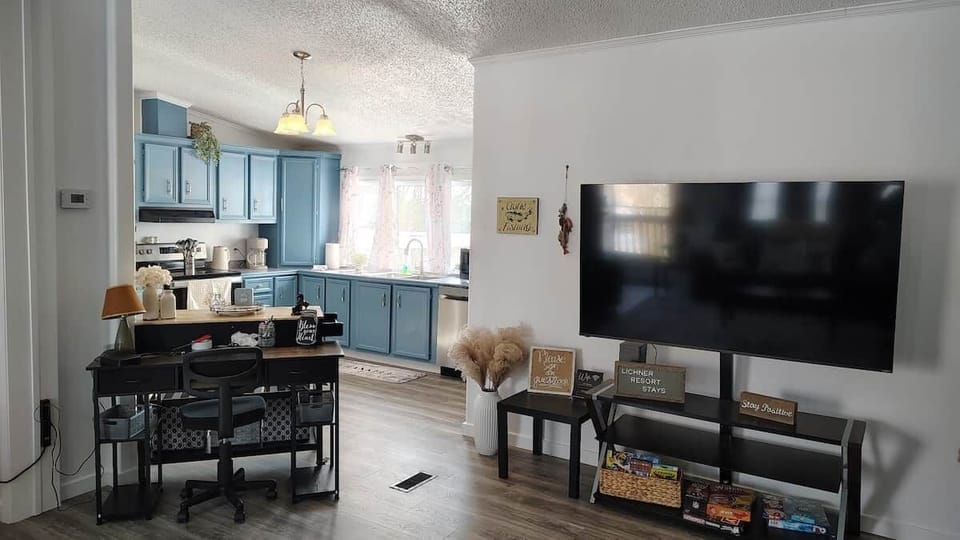Spacious living room with queen sofa sleeper at Norfork Lake vacation rental