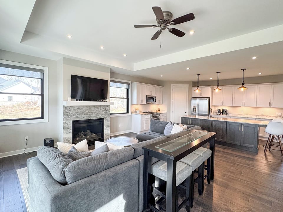 Open concept living room with gas fireplace.