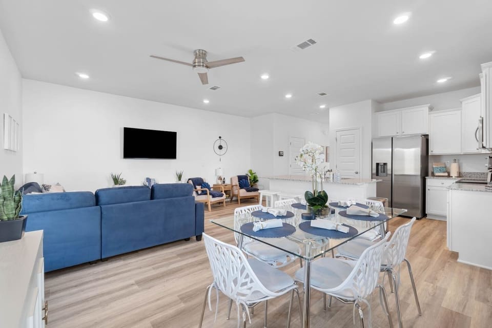 Elegant dining setting for 6 (in addition to the 4 barstools). Comfortable to Sit in: these modern chairs are very comfortable given the curved shape of the seat. Enjoy 55" Smart TV from here as well as from the comfort of the couch or armchairs