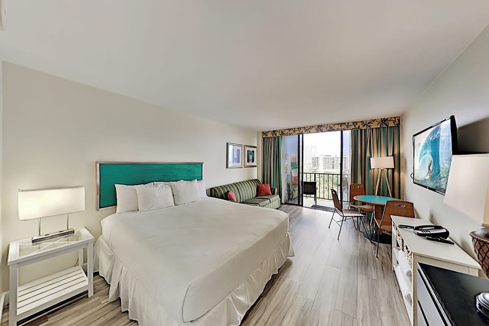 Updated flooring in studio with king bed, queen sofa sleeper, dinette and  
private lanai