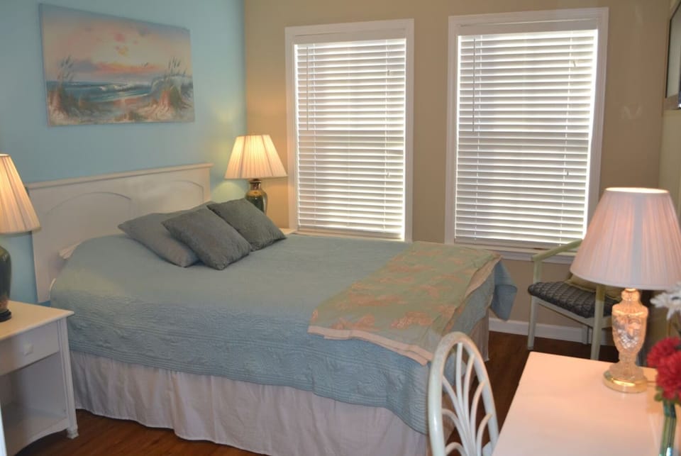 Comfortable bedroom with soft linens and coastal charm