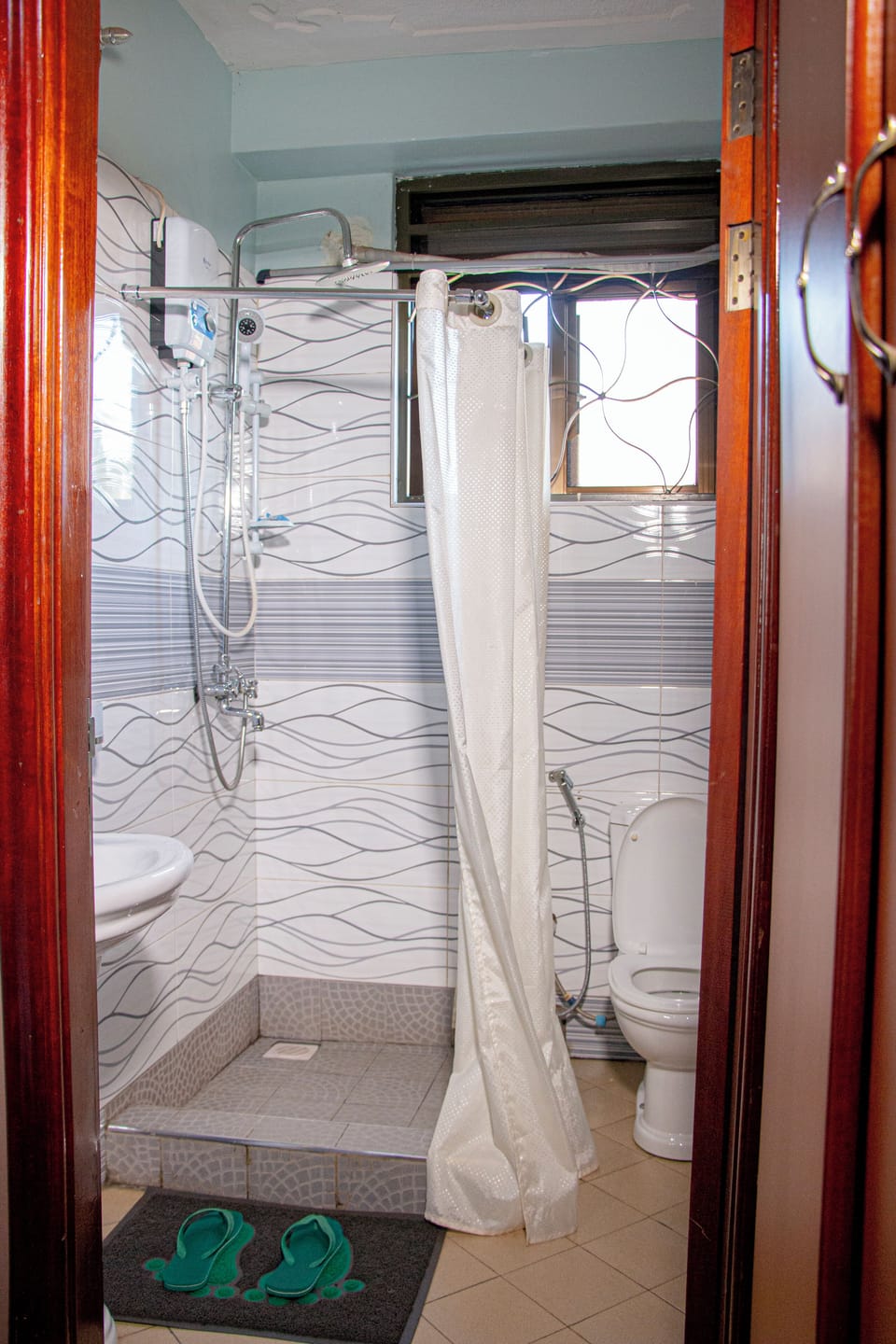 Shower, slippers, towels, soap