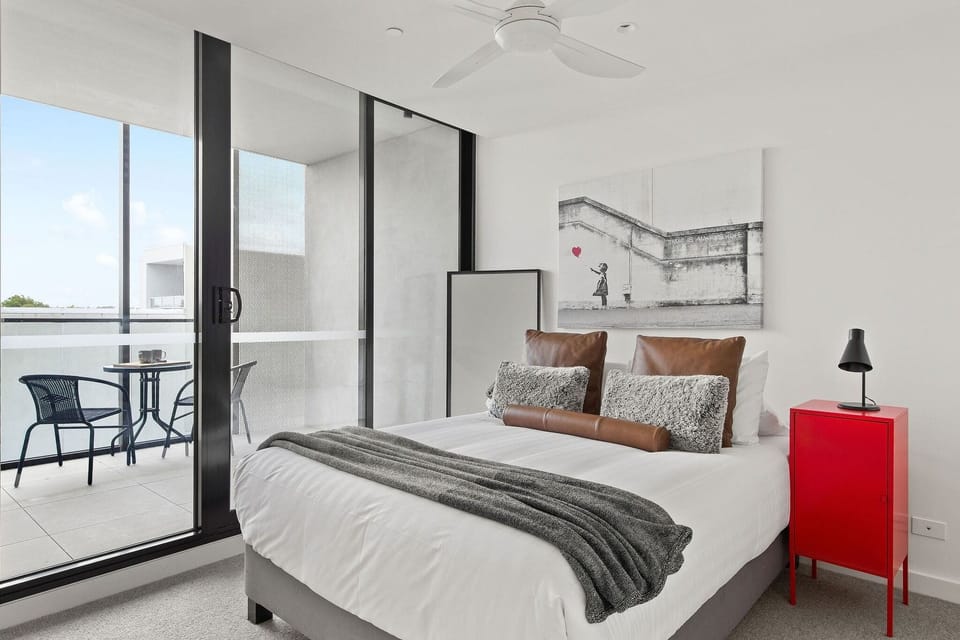 The 2nd bedroom with a queen sized bed & a balcony. (Balcony setting was from the masters balcony for photography purposes).