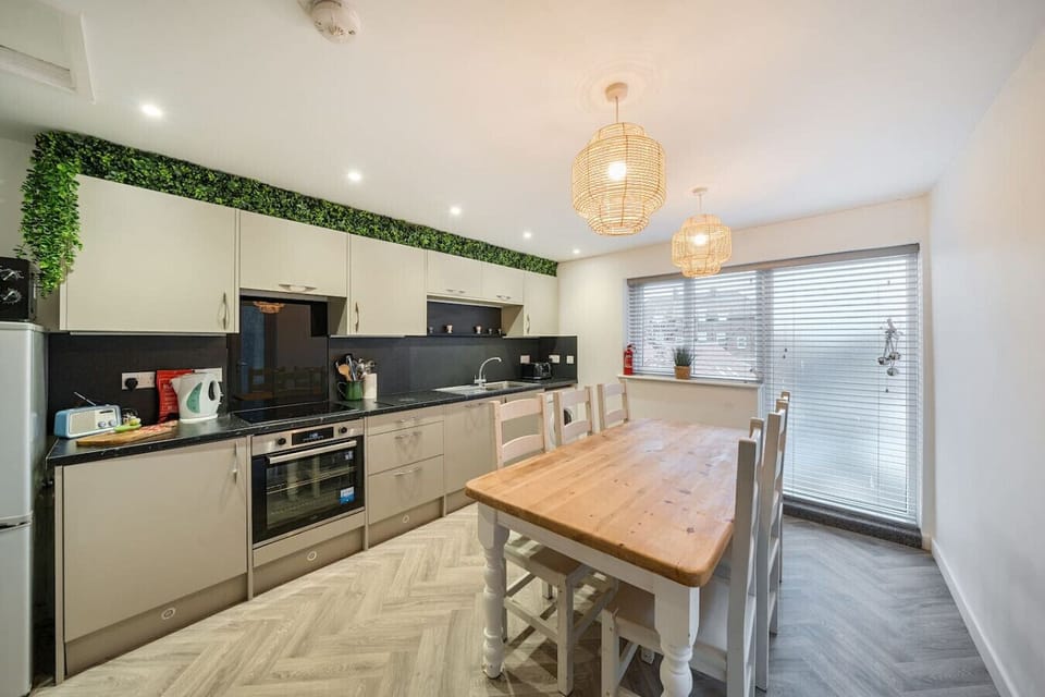 Gather around the dining table and cook meals together in the open kitchen