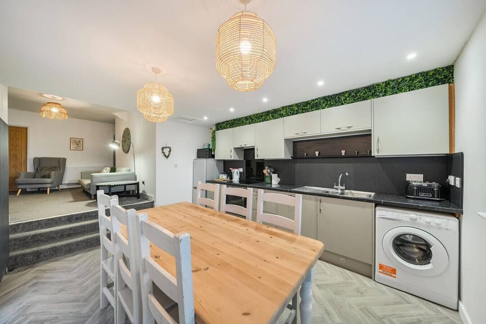 Cook and dine comfortably with a modern kitchen run and large dining table