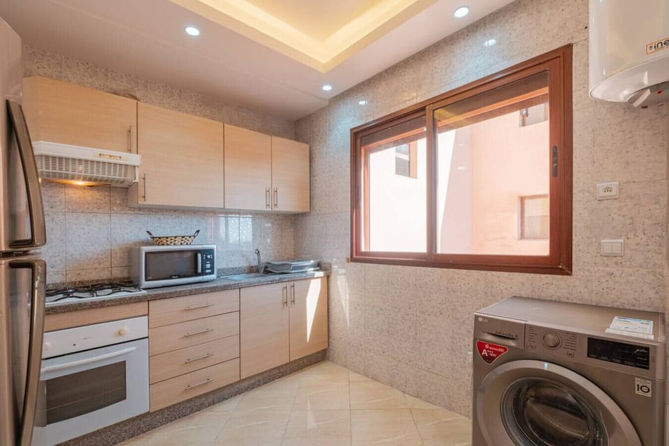 Fully equipped kitchen with modern appliances.