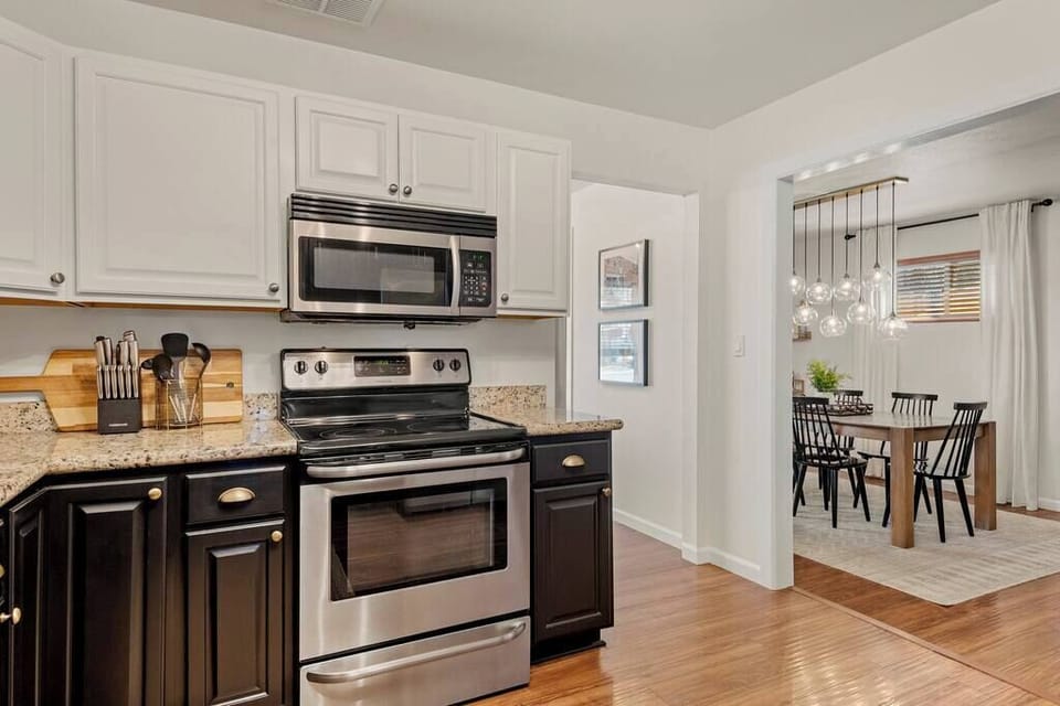Electric range and oven with a clear view through to the dining area.