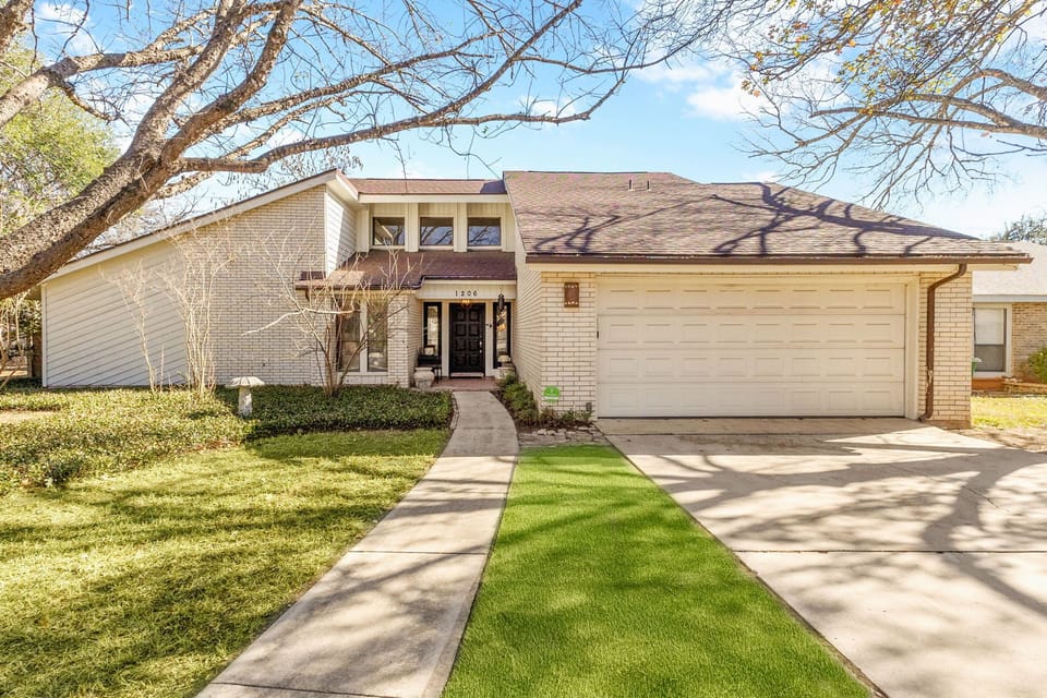Spacious home exterior with easy driveway parking in a quiet San Antonio neighborhood.